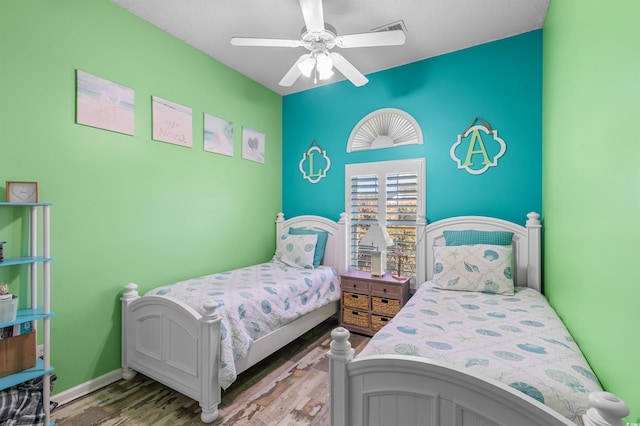 bedroom featuring ceiling fan and hardwood / wood-style floors