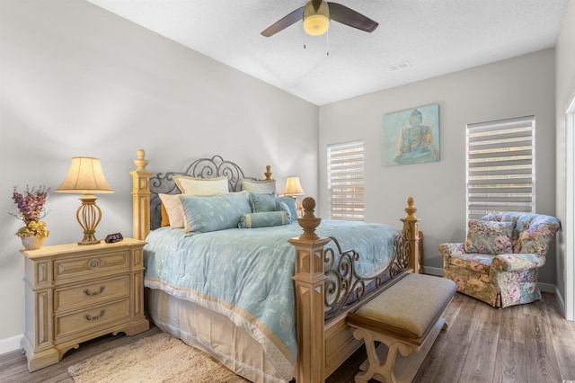 bedroom featuring ceiling fan and hardwood / wood-style floors