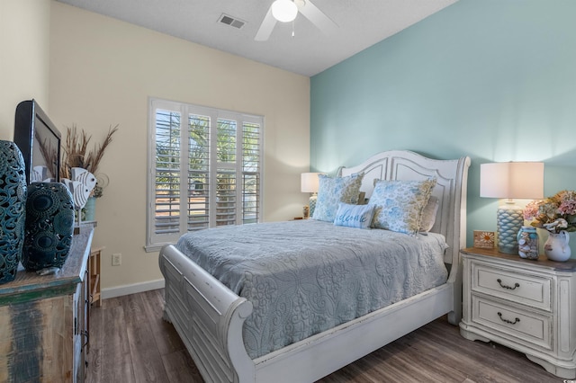 bedroom featuring ceiling fan and dark hardwood / wood-style floors