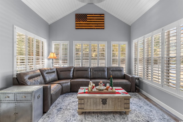 living room featuring hardwood / wood-style flooring, high vaulted ceiling, and wood ceiling