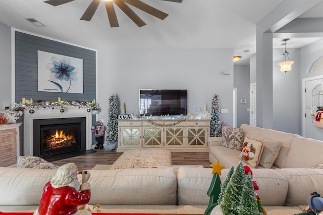 living room with ceiling fan and hardwood / wood-style flooring