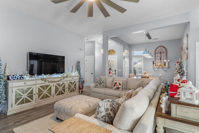 living room featuring ceiling fan and hardwood / wood-style flooring