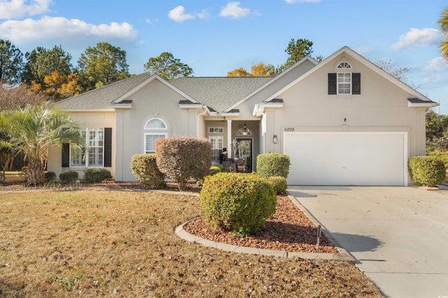 view of front of property with a garage