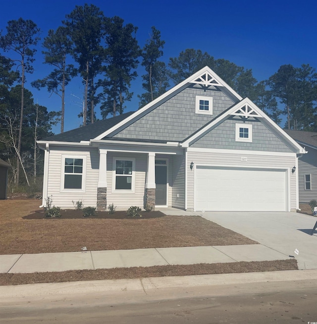 craftsman house featuring a garage and driveway