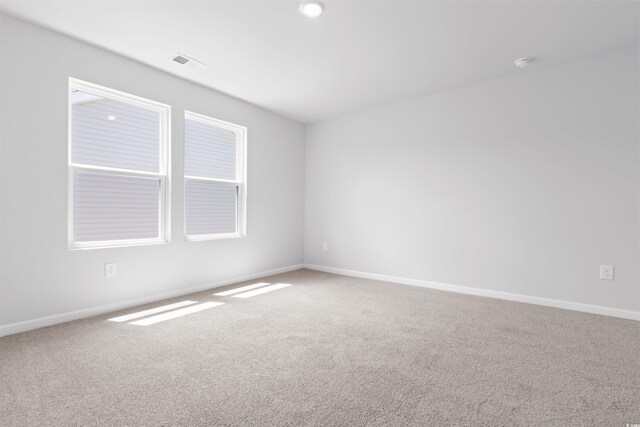 empty room featuring carpet flooring