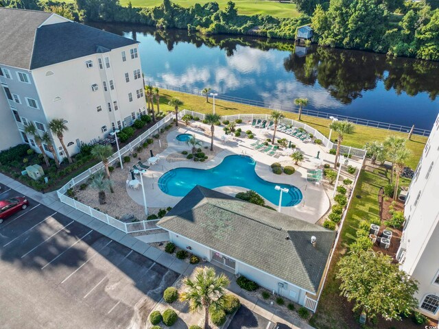 birds eye view of property with a water view