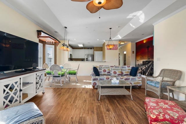 living room with ceiling fan and wood-type flooring