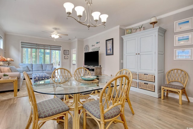 dining area featuring crown molding, ceiling fan with notable chandelier, and light wood-type flooring