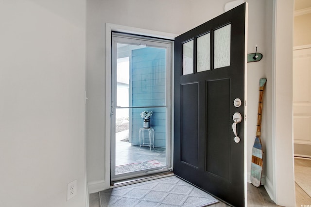 entryway with hardwood / wood-style flooring