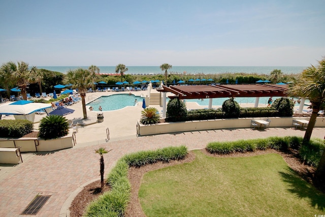 view of pool with a water view