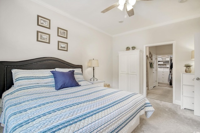 bedroom with connected bathroom, light colored carpet, ceiling fan, and crown molding