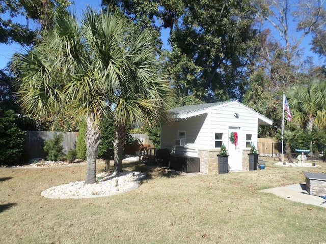 exterior space with a yard and an outbuilding