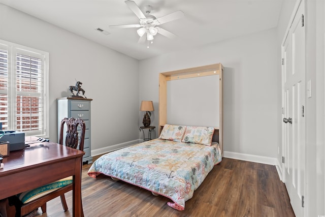 bedroom featuring ceiling fan and dark hardwood / wood-style flooring