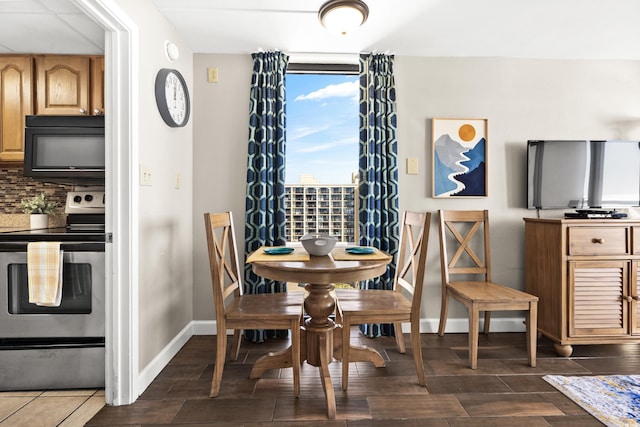 dining area featuring dark hardwood / wood-style flooring