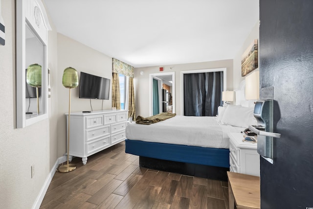 bedroom with dark wood-type flooring