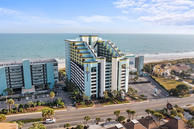 aerial view with a water view and a view of the beach