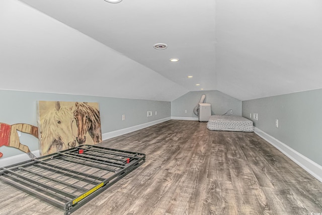 bedroom featuring hardwood / wood-style flooring and vaulted ceiling