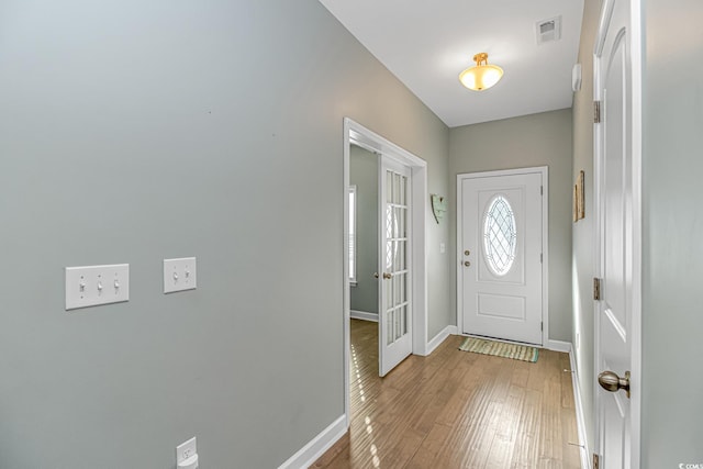 entryway with light hardwood / wood-style floors