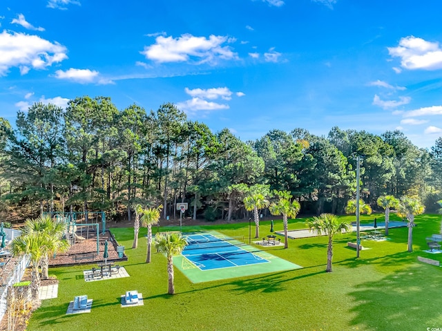 surrounding community featuring a playground and a yard