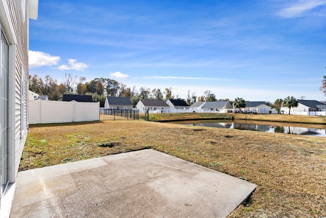 view of yard featuring a patio area and a water view