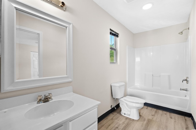 full bathroom with vanity, toilet, wood-type flooring, and tub / shower combination