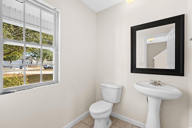 bathroom featuring tile patterned floors and toilet