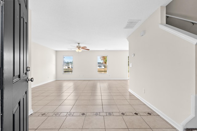 interior space featuring ceiling fan and light tile patterned flooring