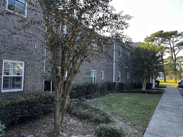 view of home's exterior with a lawn