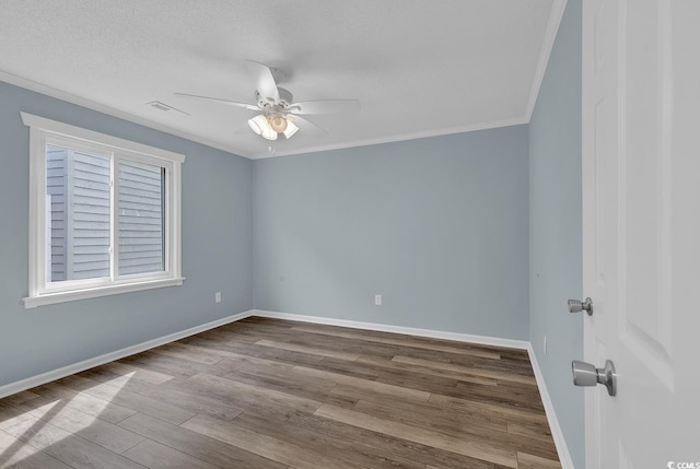 empty room featuring crown molding, light hardwood / wood-style flooring, ceiling fan, and a textured ceiling