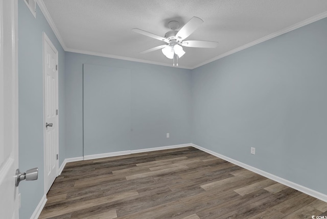 unfurnished room featuring ceiling fan, wood-type flooring, a textured ceiling, and ornamental molding