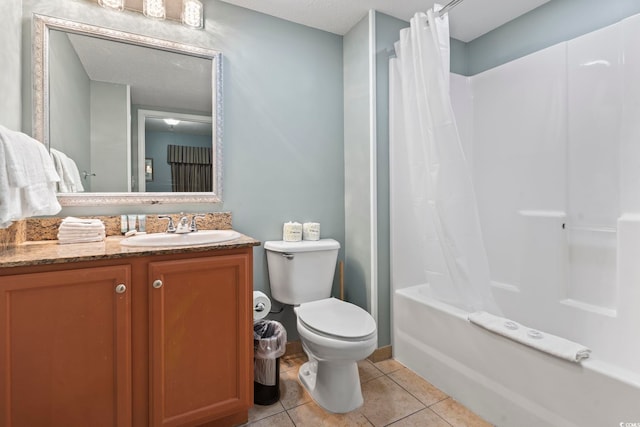 full bathroom featuring shower / bathtub combination with curtain, vanity, tile patterned floors, and toilet