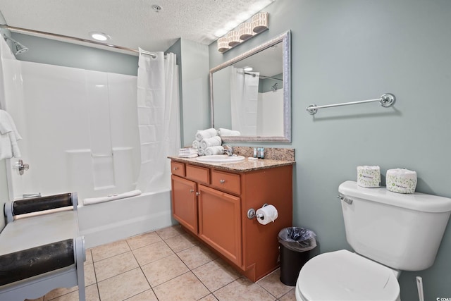 full bathroom featuring shower / tub combo with curtain, tile patterned floors, toilet, a textured ceiling, and vanity