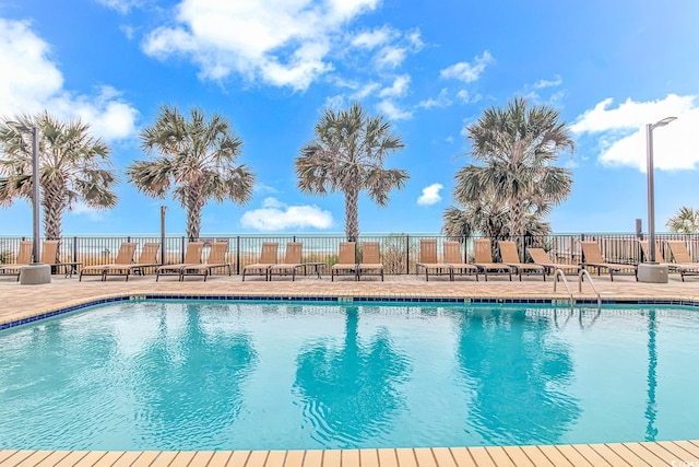 view of pool featuring a patio area