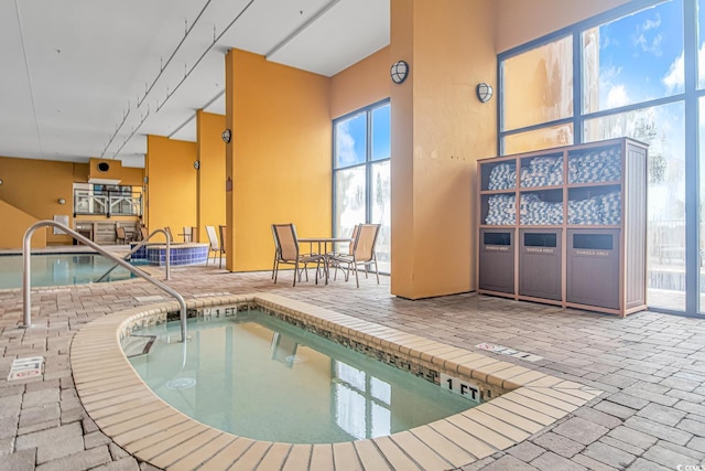 view of swimming pool featuring an indoor in ground hot tub