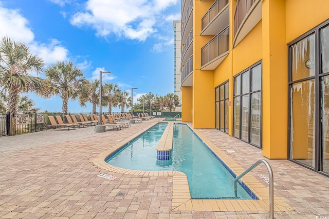 view of pool featuring a patio