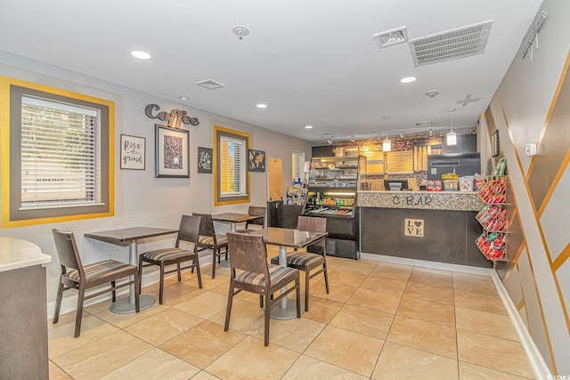 dining room with light tile patterned floors