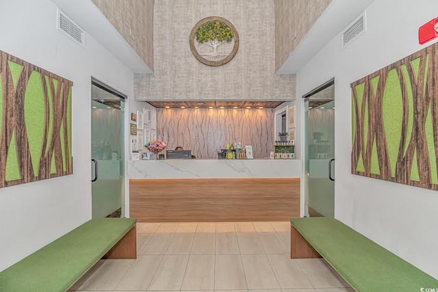 interior space featuring independent shower and bath and tile patterned floors