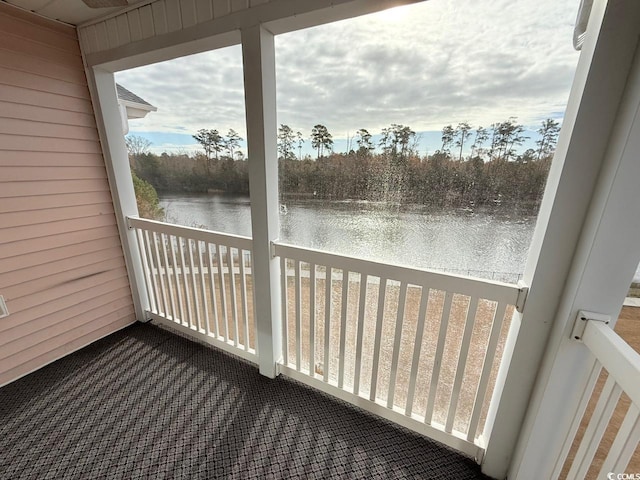 sunroom / solarium with a water view