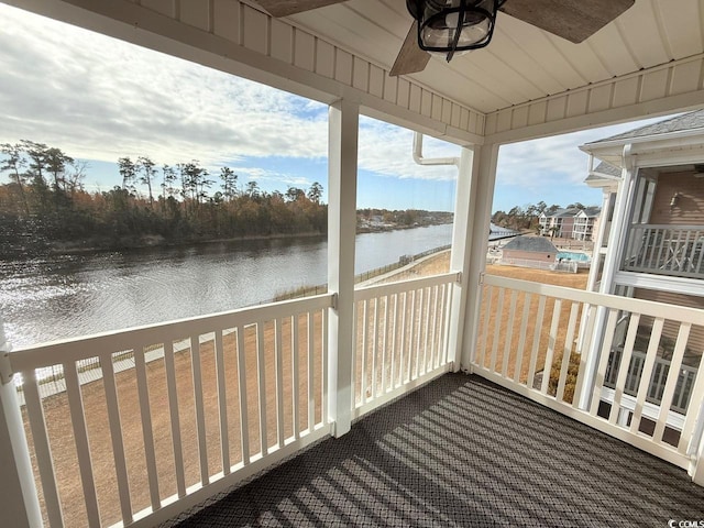 deck featuring a water view and ceiling fan