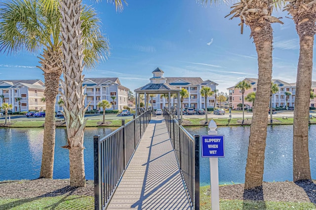 dock area with a gazebo and a water view