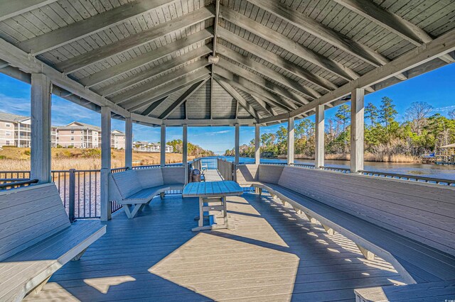 deck with a gazebo and a water view