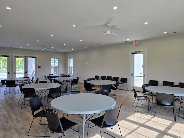 dining area featuring ceiling fan, light wood-type flooring, and french doors