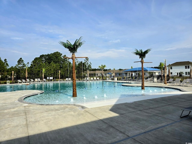 view of swimming pool featuring a patio