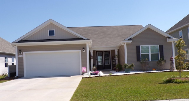 3070 Sutherland Dr, Little River, SC 29566 - view of front of property featuring a front yard, driveway, and an attached garage