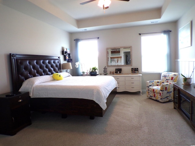 3070 Sutherland Dr, Little River, SC 29566 - bedroom featuring multiple windows, light colored carpet, and ceiling fan
