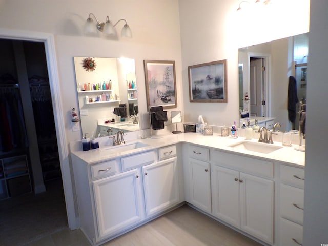 3070 Sutherland Dr, Little River, SC 29566 - bathroom with double vanity and a walk in closet