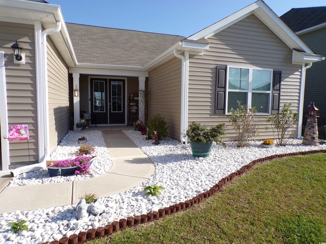 3070 Sutherland Dr, Little River, SC 29566 - view of exterior entry featuring a shingled roof