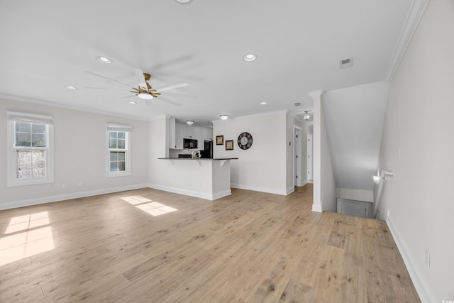 unfurnished living room with light hardwood / wood-style flooring, ceiling fan, and crown molding