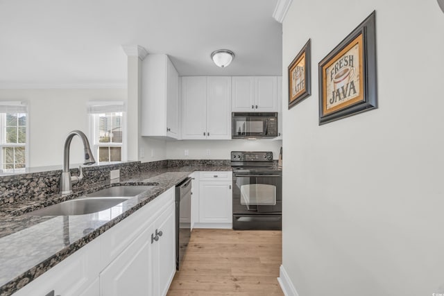 kitchen featuring black appliances, white cabinets, sink, and dark stone counters