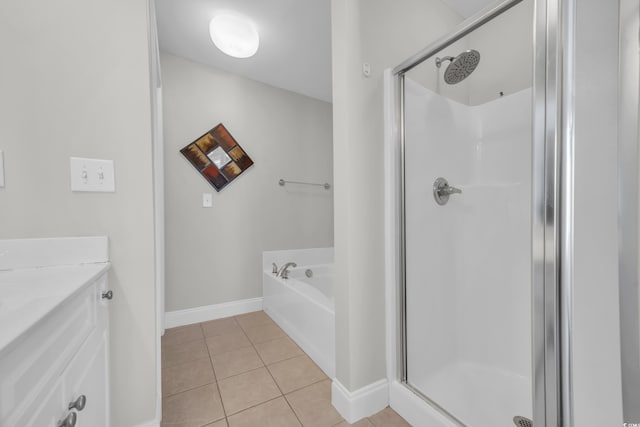 bathroom featuring separate shower and tub, tile patterned flooring, and vanity